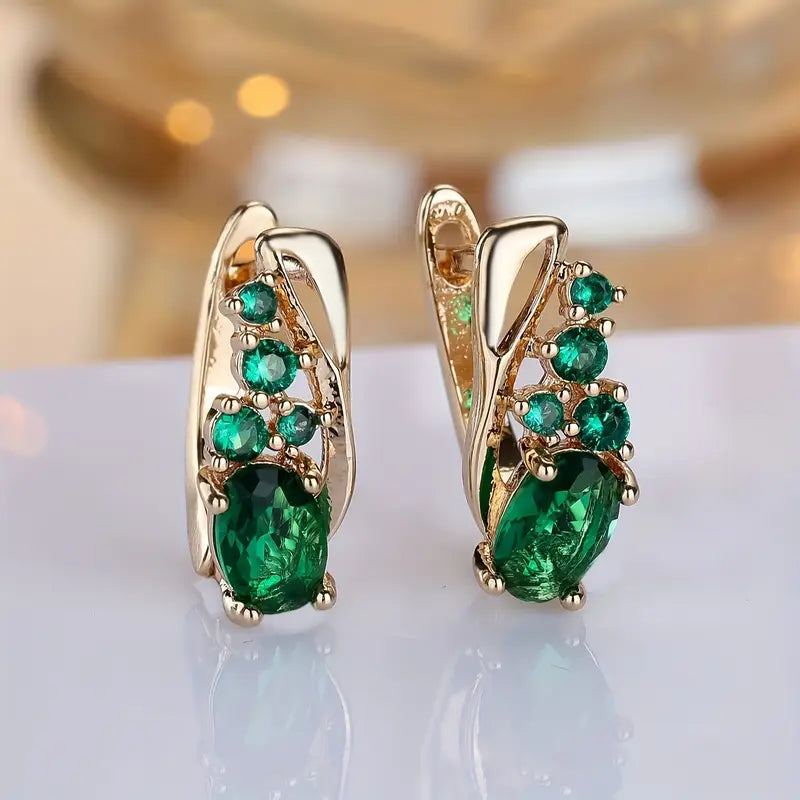 Boucles d'oreilles pendantes en or et émeraudes — Doumira