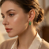 Boucles d'oreilles pendantes en or et émeraudes — Doumira