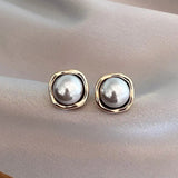 Boucles d'oreilles élégantes en perle noire — Doumira
