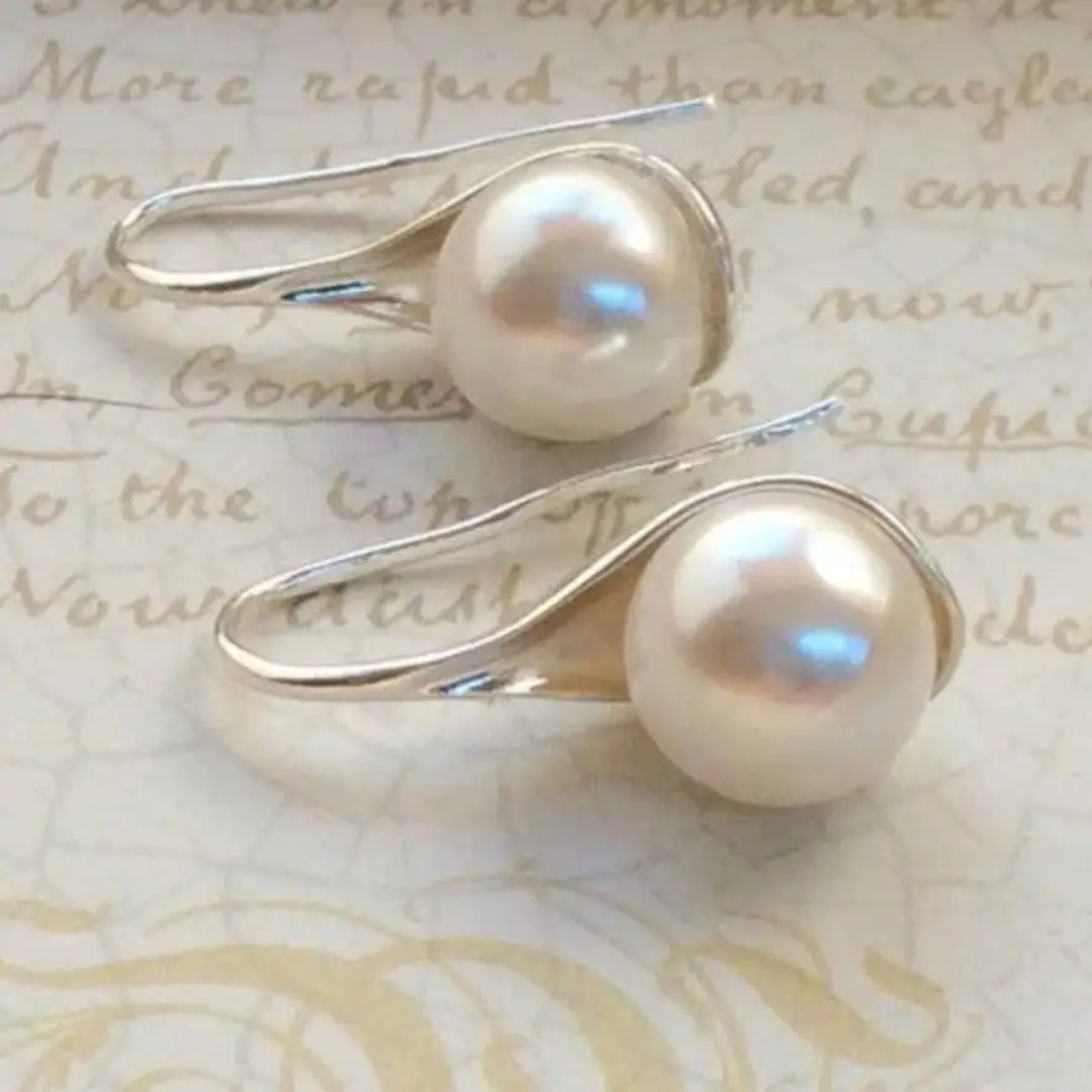 Boucles d'oreilles en forme de goutte avec des marguerites — Doumira