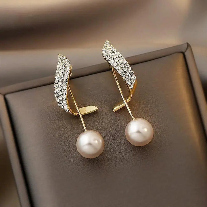 Boucles d'oreilles en or avec perles — Doumira