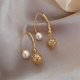 Boucles d'oreilles rétro en or avec des marguerites — Doumira