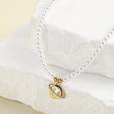 Collier perle planete — Doumira